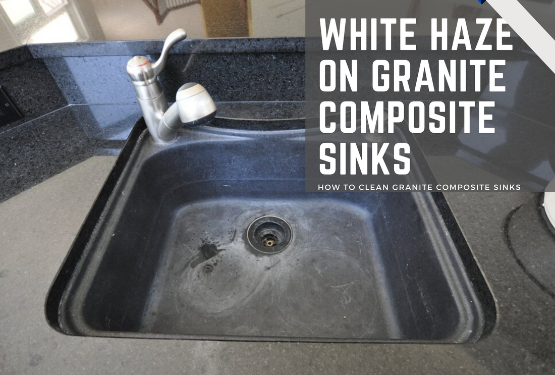 A white haze on a black composite granite sink and a black pearl granite countertop.