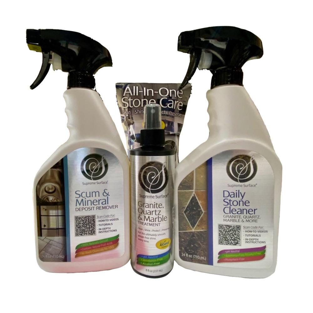 Supreme Surface® Care Kit for New Countertops and Sinks. From left to right this image shows Supreme surface Scum and Mineral Deposit Remover 24 oz Spray, Granite Quartz and Marble Treatment 8 oz Spray with Micro Fiber Towel, and Daily Stone Cleaner For Granite Quartz Marble & More.